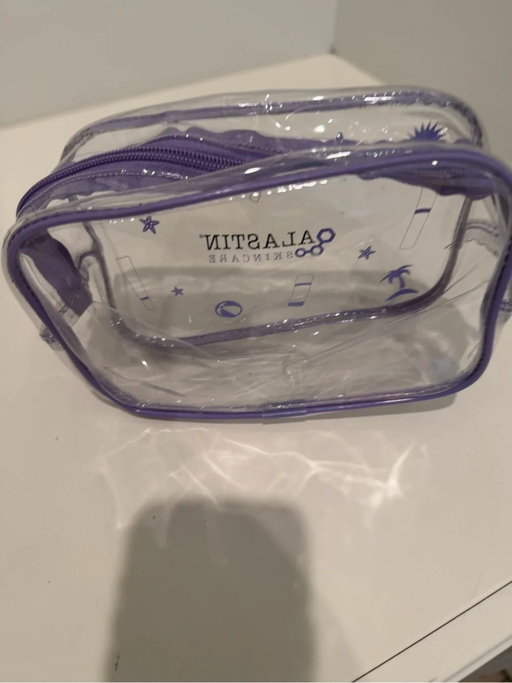 Alastin Skincare Clear Travel Cosmetic Bag - Purple Trim